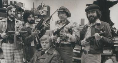 Lt. Robert Arscott and the Operation Sting team sit amid stolen goods
