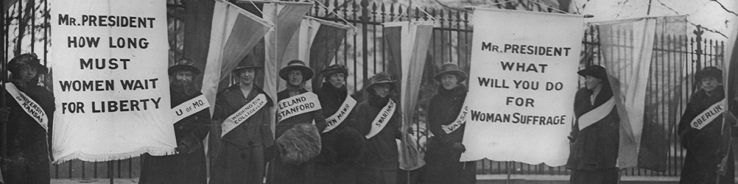 Women suffragists picketing in front of the White house on "College Day" in 1917. (Source: Wikipedia)